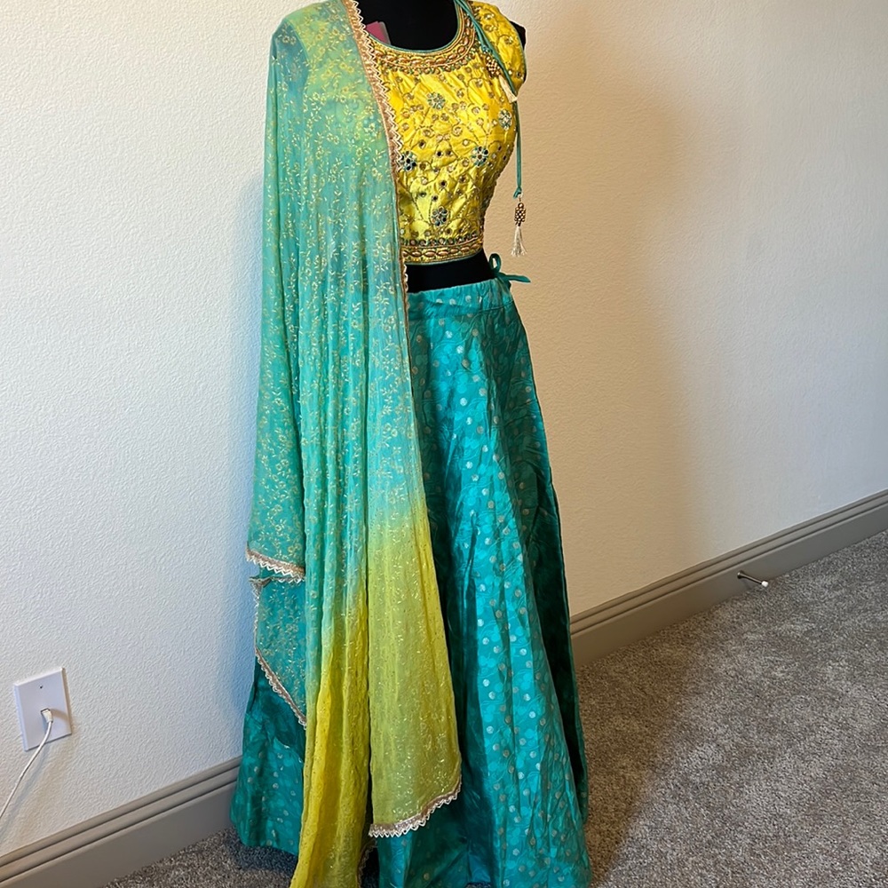 silk lehenga with embroidered work and georgette chunni.